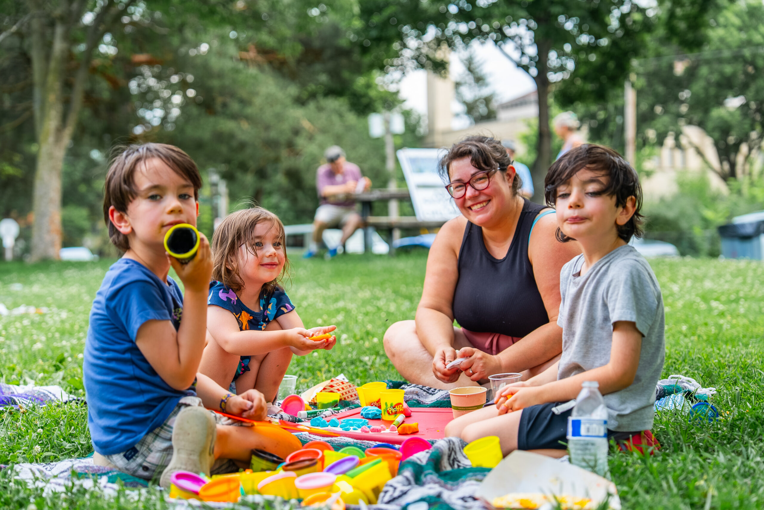 Children and an adult enjoying a community gathering