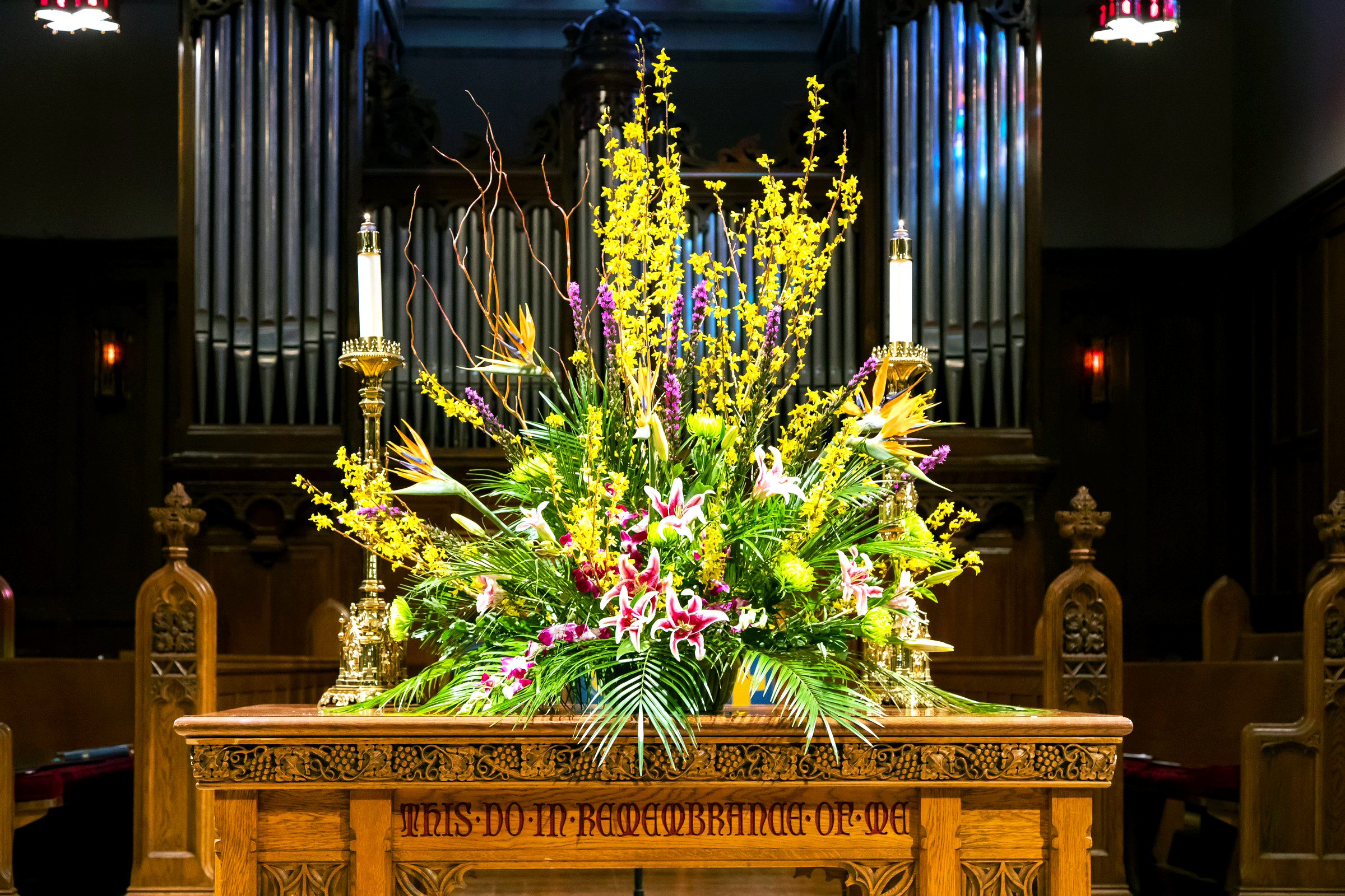 Colorful flowers arranged on the communion table at House of Hope