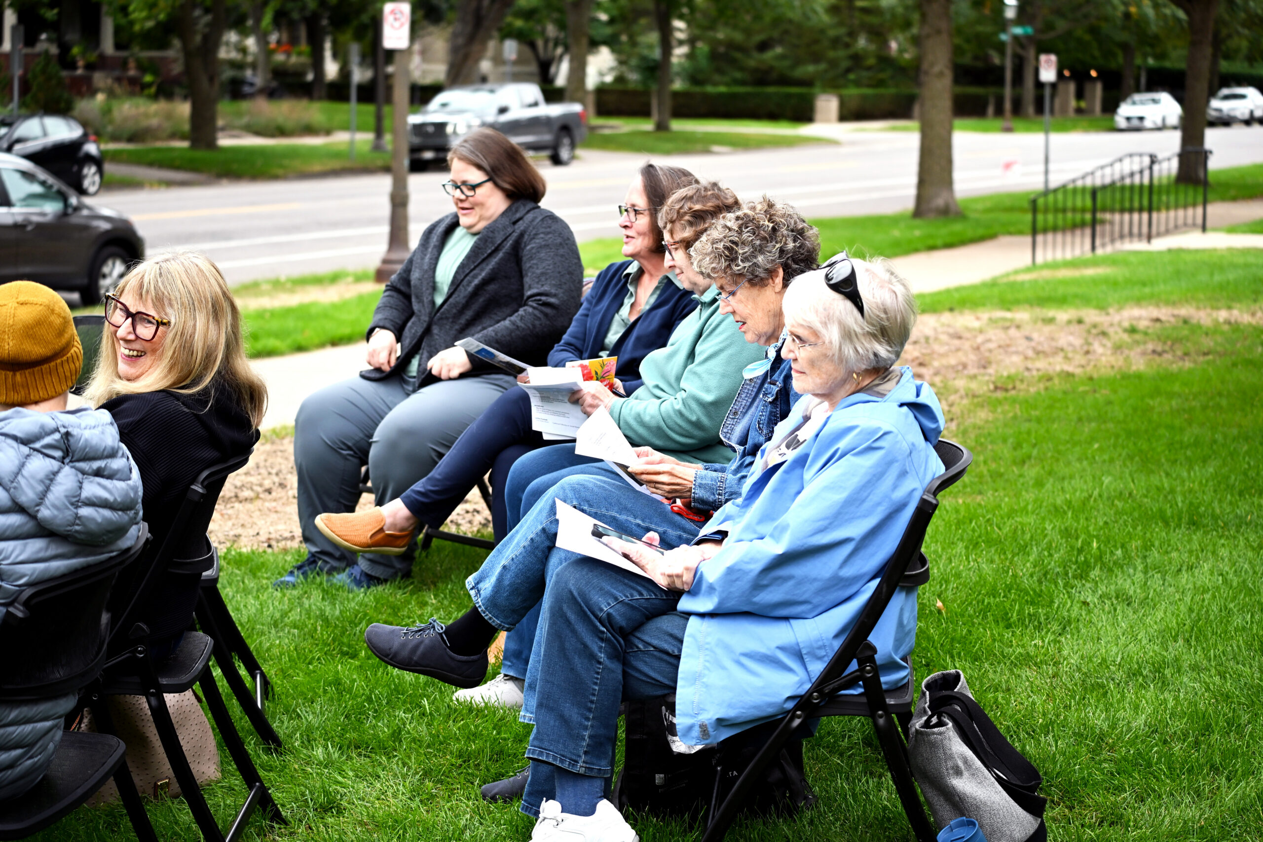 Community members gather outdoors for the House of Hope Peace Pole commissioning.