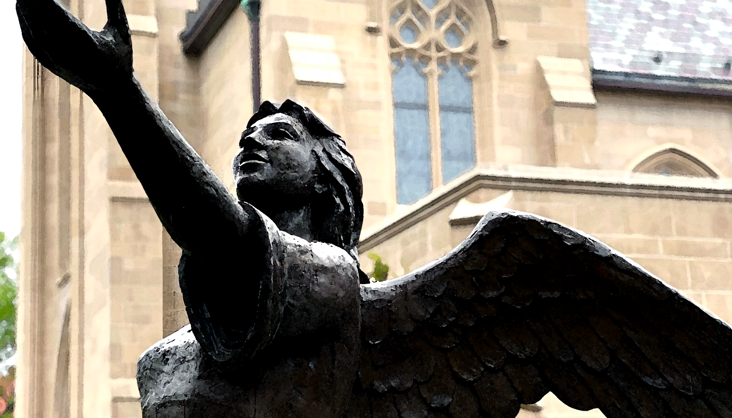 A winged bronze sculpture with an outstretched arm in front of House of Hope’s stone church.